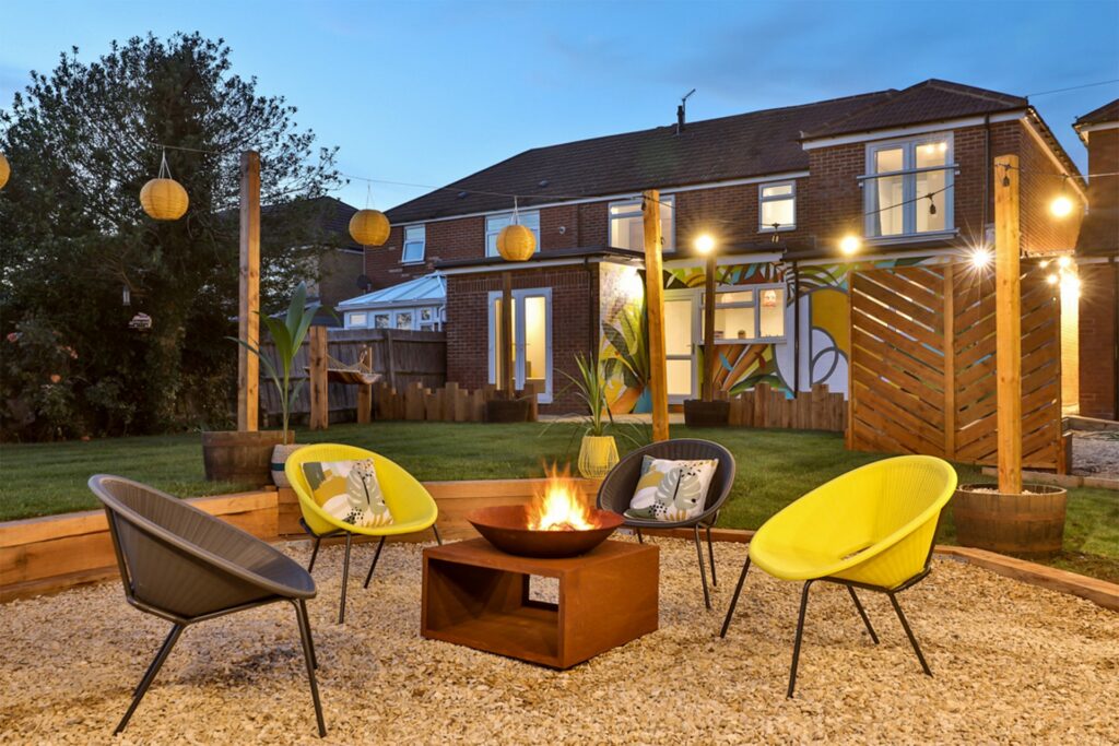 B-Hive Living outdoor social area with a firepit