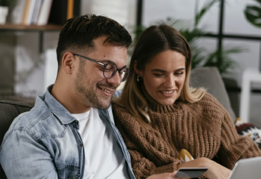 Young couple comparing accommodation costs and commute options across Oxfordshire job hubs