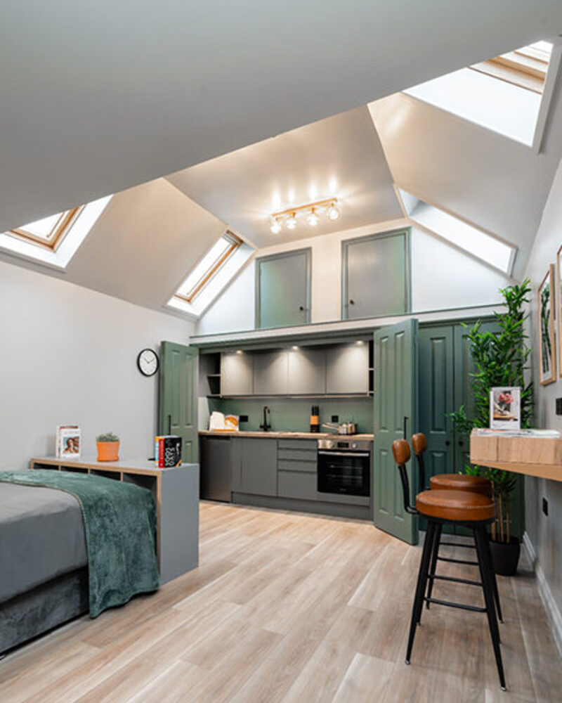 Self-contained furnished studio loft with kitchen and bed, ideal for flexible temporary housing in Bicester