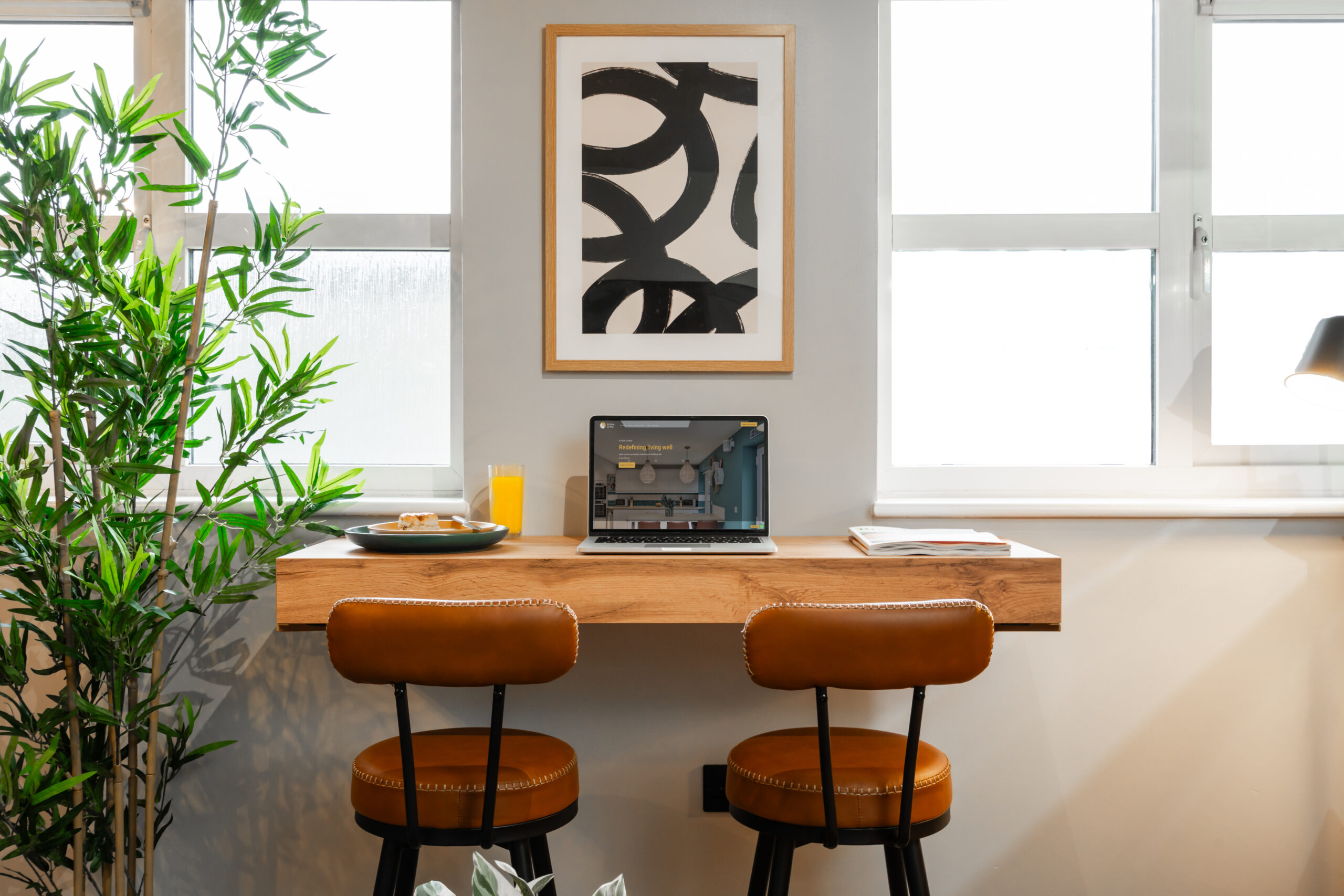 Dedicated home workspace with desk and laptop for remote professionals living in Bicester