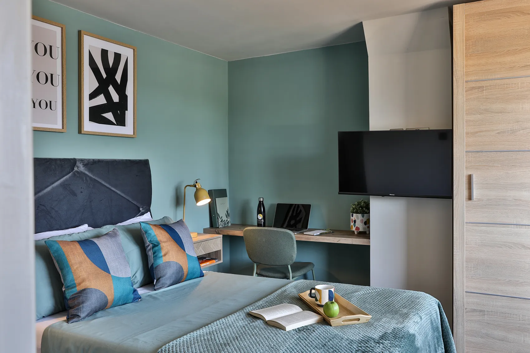 Dedicated desk workspace and high-speed setup in private corporate accommodation bedroom