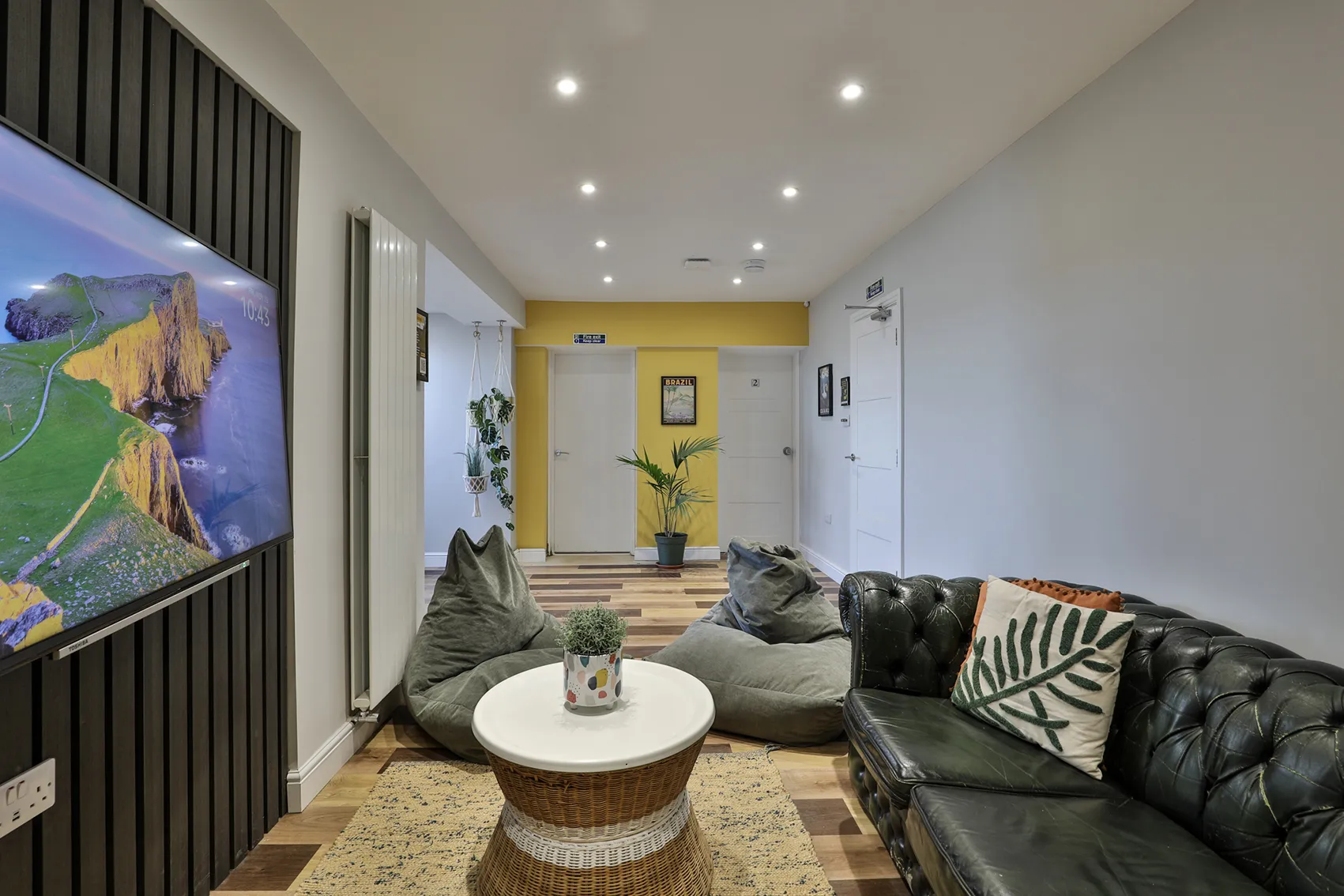 Shared lounge and media space with Chesterfield sofa at B-Hive Living in Bicester for relaxing after shifts