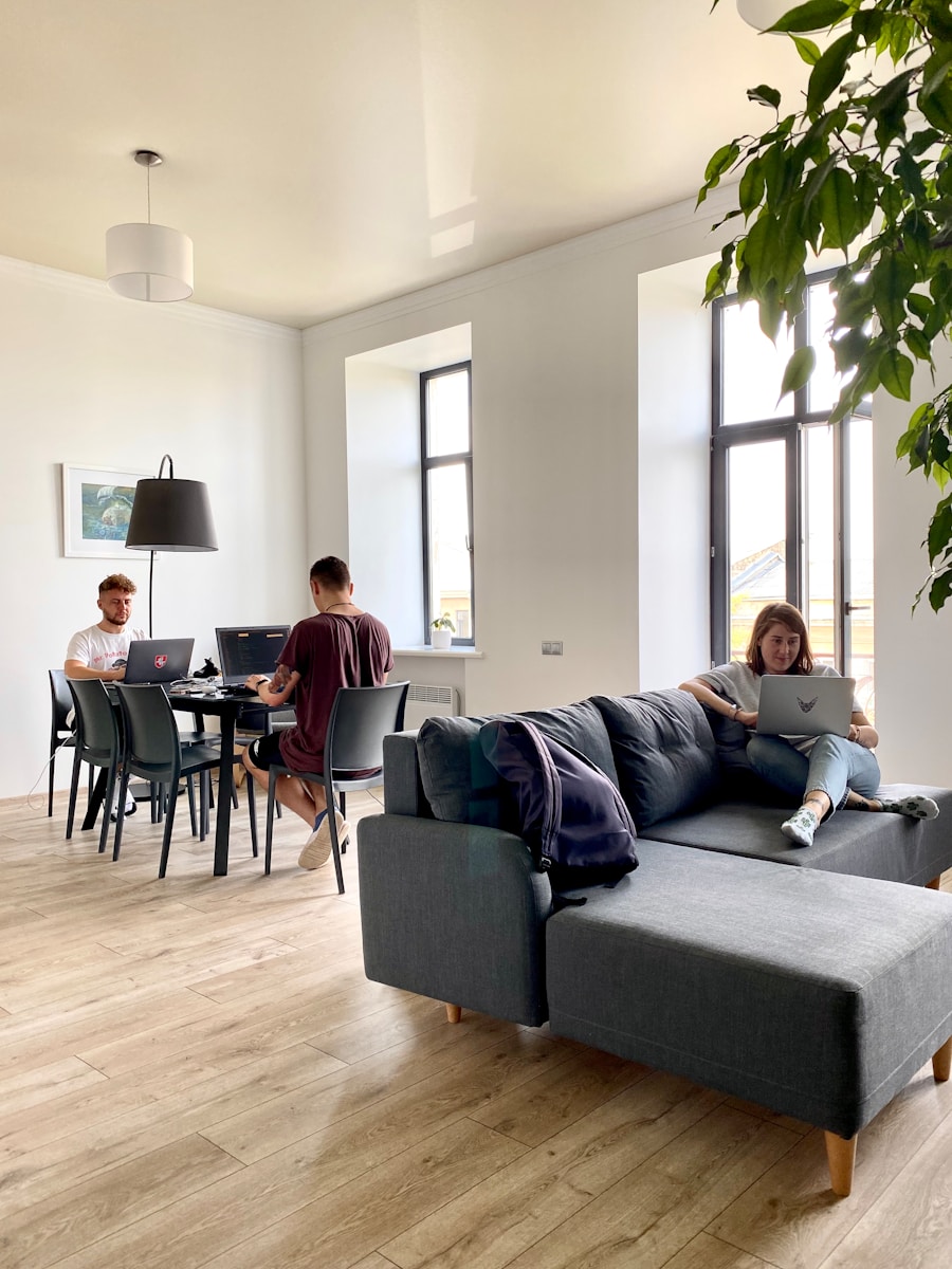 Young engineering and technology professionals working flexibly in a bright modern co-living space in Oxfordshire