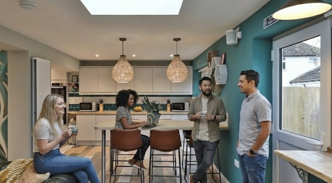 Life sciences and tech professionals collaborating and having coffee in a shared kitchen