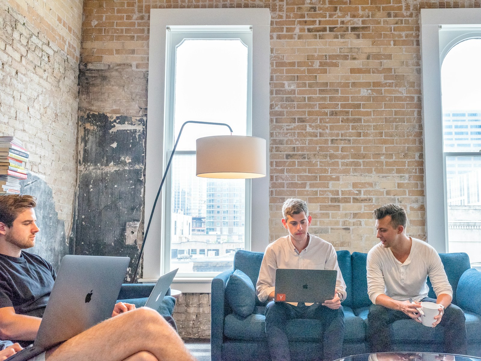Young professionals and tech researchers collaborating in a modern workspace near Oxfordshire science and innovation hubs